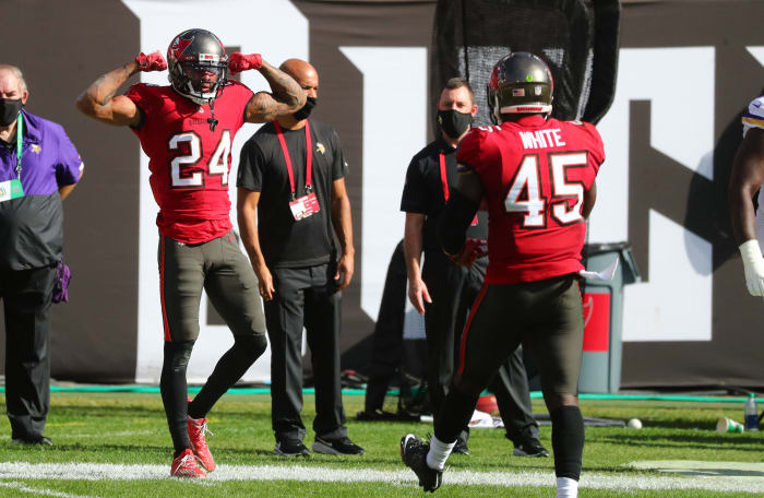 Tampa Bay Buccaneers cornerback Carlton Davis III (left) and linebacker Devin White (right) celebrate a play.